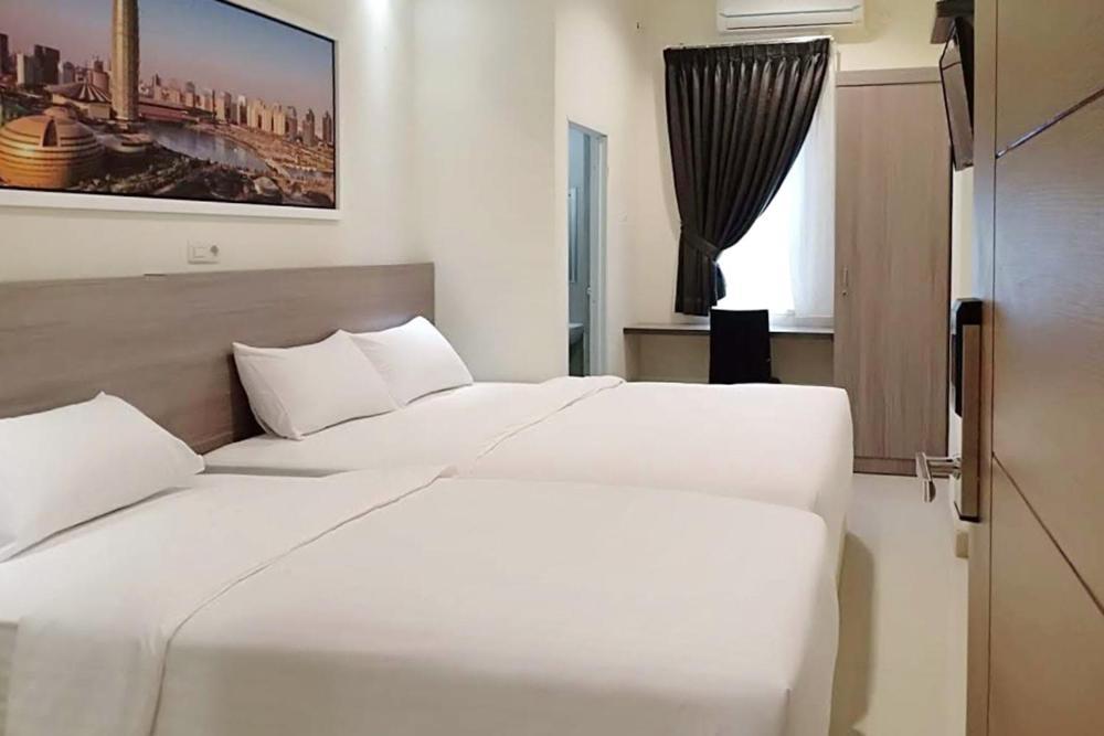 Twospaces Living At Maximus Inn ปาเลมบัง ภายนอก รูปภาพ